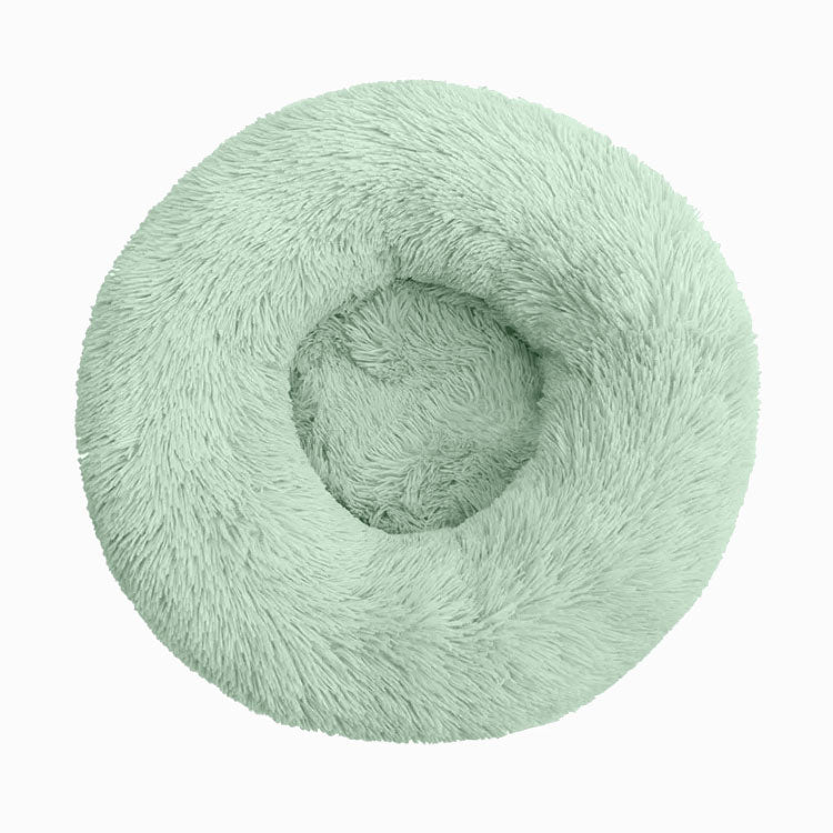Light green faux-fur donut bed for dogs and cats