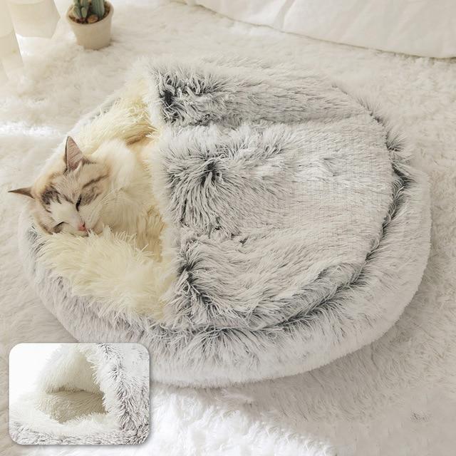 Cat relaxing in an arctic grey calming dog bed