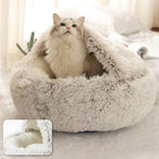 Cat sitting in a coffee latte calming pet bed