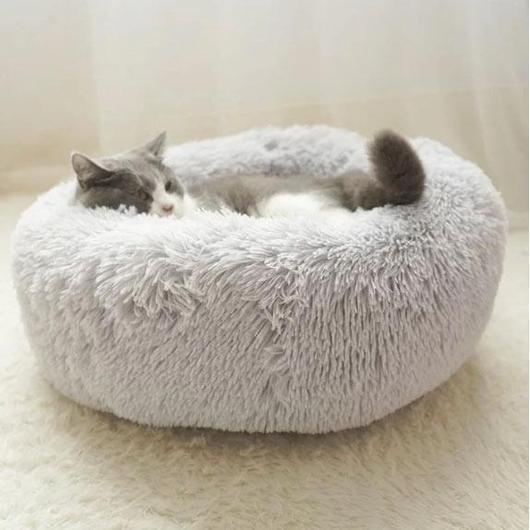 Grey donut pet bed with a raised padded rim
